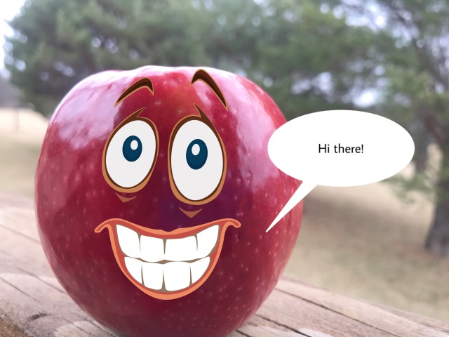apple on a fence with a talk bubble that says Hi There